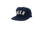 Navy blue cap with 'BEER' printed on it against a white background